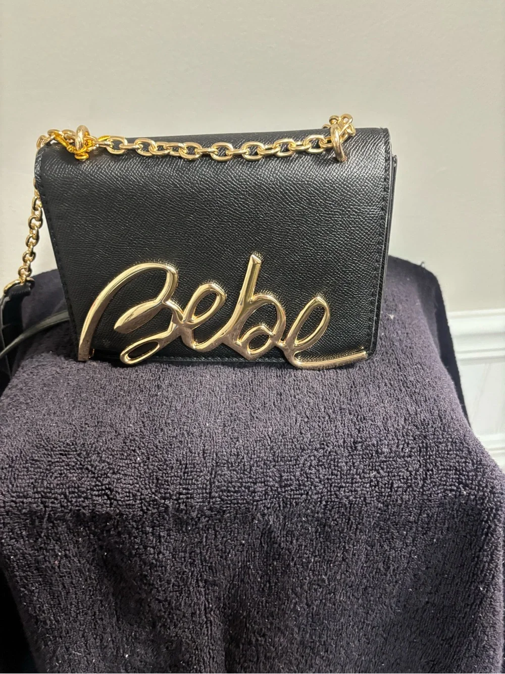 bebe Black Crossbody Clutch with Gold Script Logo